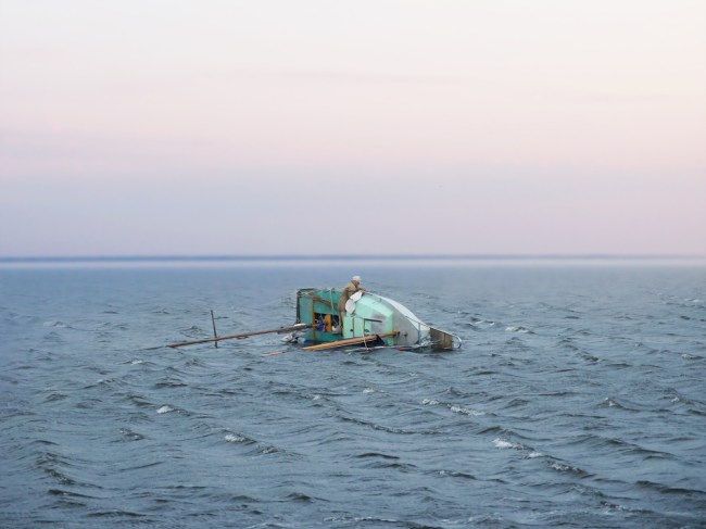 capsizing sailboat