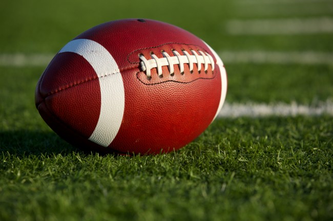A football rests on the field.