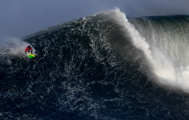 Australian big wave surfer Jamie Mitchell paddles for a wave during the 2nd heat of the 1st round of the WSL Nazare Challenge at Praia do Norte in Nazare, central Portugal, on February 10, 2018.
