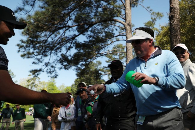 fan handing jason day ball beer the masters