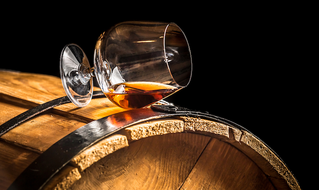 whiskey glass on barrel