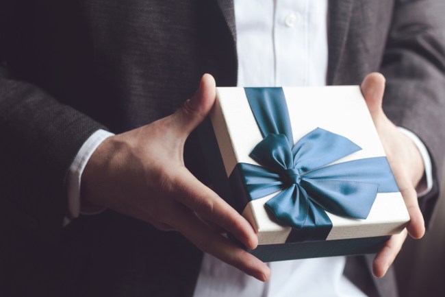 man holding gift