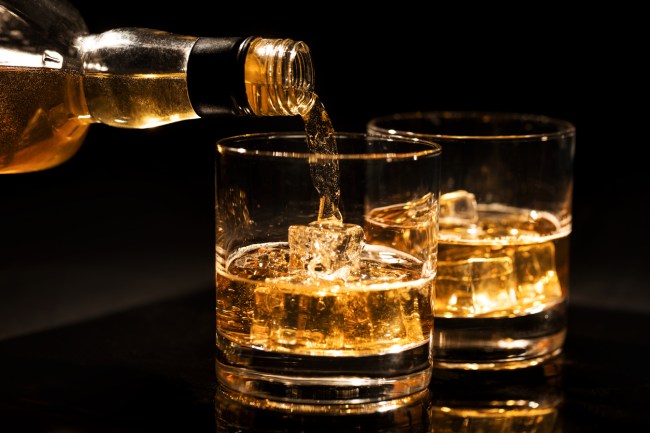 pouring whiskey into glasses