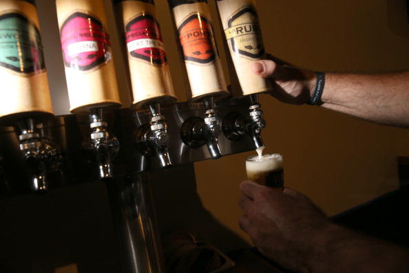 Dominic Rocci pours a beer from the tap at the Wynwood Brewing Company on April 25, 2014 in Miami, Florida. Earlier this week Floridas Senate Rules Committee voted 9-4 for a bill that would heavily restrict the states craft breweries such as the Wynwood Brewing Company and is supported by the Florida Beer Wholesalers Association, which has controlled beer distribution in the state for decades.