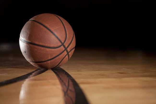 march madness basketball on court NCAA tournament college