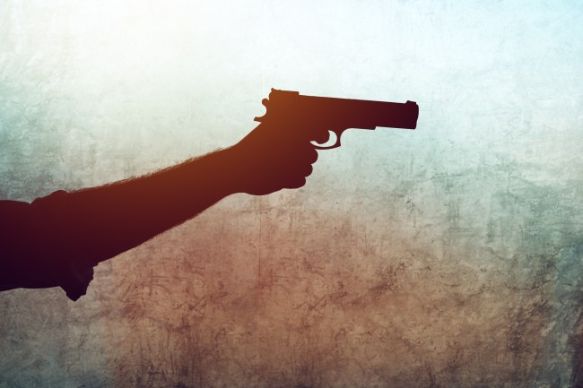 hand holding a gun