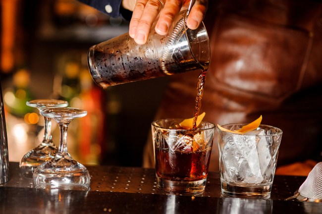 bartender pouring bourbon drink