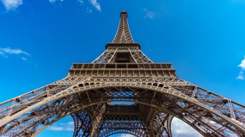 Lunatic Puts Eiffel Tower On Lockdown After He Attempts To Scale Paris’ Tallest Structure Without A Rope (Pics + Vid)