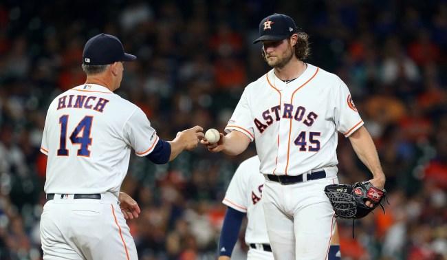 HOUSTON, TEXAS - AUGUST 28: Gerrit Cole #45 of the Houston Astros hands the ball to manager AJ Hinch #14 as he ties his season high with 14 strikeouts against the Tampa Bay Rays at Minute Maid Park on August 28, 2019 in Houston, Texas. (Photo by Bob Levey/Getty Images)