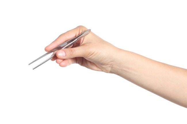 hand holding tweezers