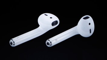 Guy Puts Realistic-Looking AirPod Stickers All Over The City, Films People Trying To Pick Them Up In A+ Prank