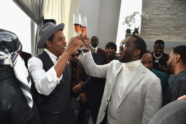 Jay-Z caught on video snatching someone's phone who was taking photos of him at Diddy's star-studded 50th birthday party.