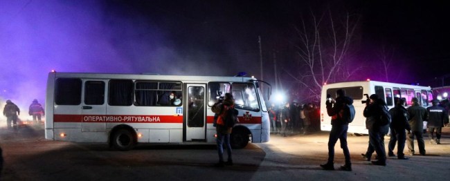 Buses carrying coronavirus evacuees attacked by protesters in Ukraine because of fake email.