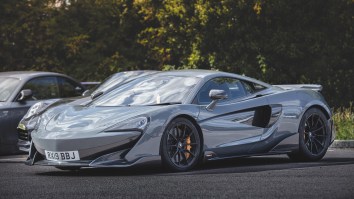 Who Ya Got? Driver In A $256K McLaren Or The Raging Floodwaters He’s Trying To Drive Through