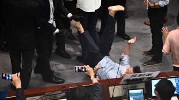 We’ve Got Politicians Climbing Walls In A Classic Scuffle In The Hong Kong Legislature