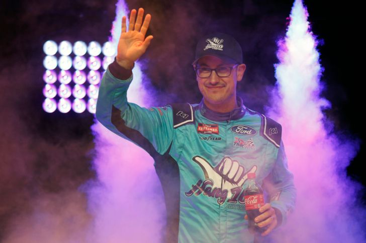 Joey Logano wearing glasses at the NASCAR Craftsman Truck Series Weather Guard Truck Race on Dirt in Bristol, Tennessee
