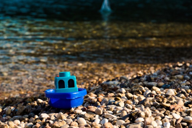 small boat washes on beach message
