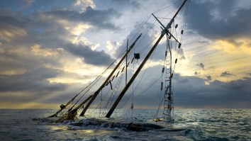 Amazing Photo Shows Man Clinging To Hull Of Capsized Boat The Moment He Is Rescued 86 Miles At Sea