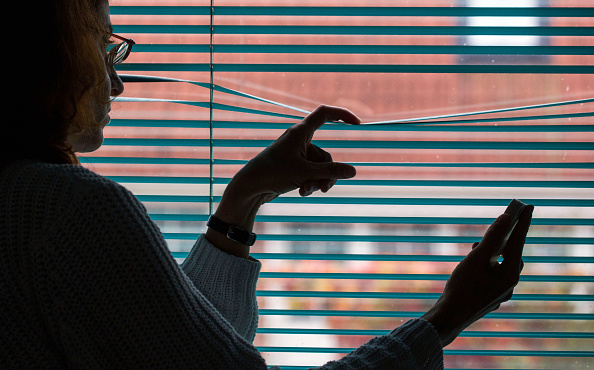 Woman looking out window