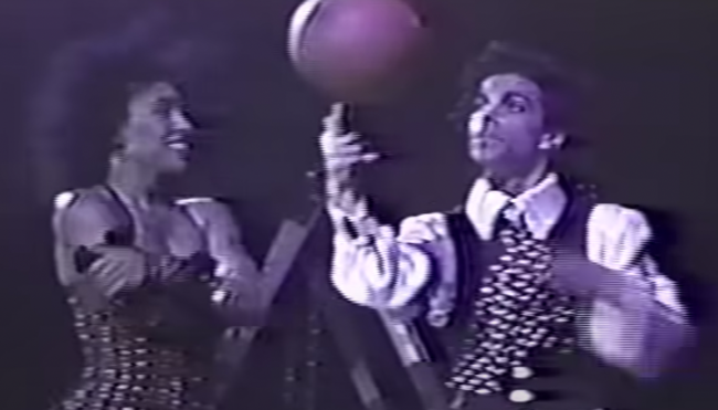 prince playing basketball during concert