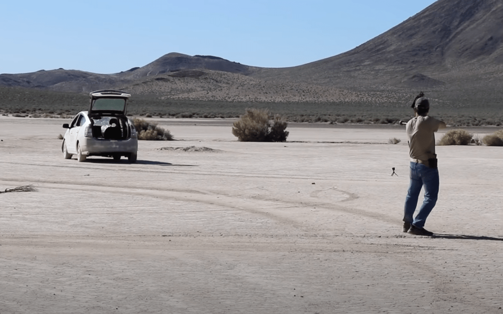 firing a grenade tipped arrow at a car for explosion