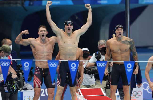 TOKYO, JAPAN - AUGUST 1: Gold Medalists of Team USA - Caeleb Dressel; Michael Andrew; Ryan Murphy; Zach Apple - celebrate winning the Men's 4 x 100m Medley Relay Final on day nine of the swimming competition of the Tokyo 2020 Olympic Games at Tokyo Aquatics Centre on August 1, 2021 in Tokyo, Japan.
