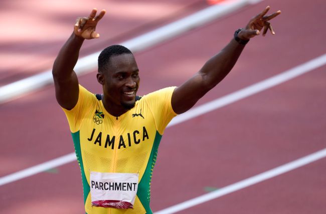 TOKYO, JAPAN - AUGUST 05: Gold medalist Hansle Parchment of Team Jamaica celebrates after competing in the Men's 110m Hurdles Final on day thirteen of the Tokyo 2020 Olympic Games at Olympic Stadium on August 05, 2021 in Tokyo, Japan.