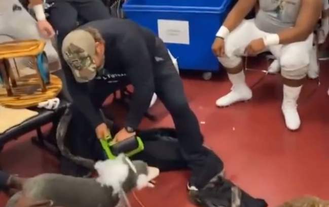 Coastal Carolina Football Chanticleers Arkansas State Locker Room Celebration Decapitate Wolf Chainsaw