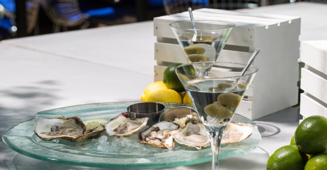 Fresh Oysters Served On Ice Accompanied By A Pair Of Dry Olive Martinis