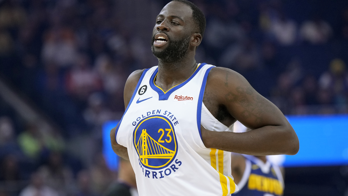 draymond green wearing a white warriors jersey