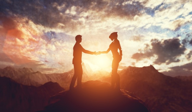 Alien and man shaking hands