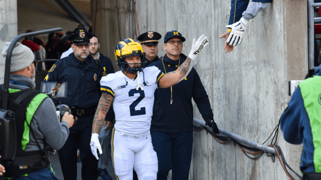 Blake Corum walks out of the Michigan tunnel.