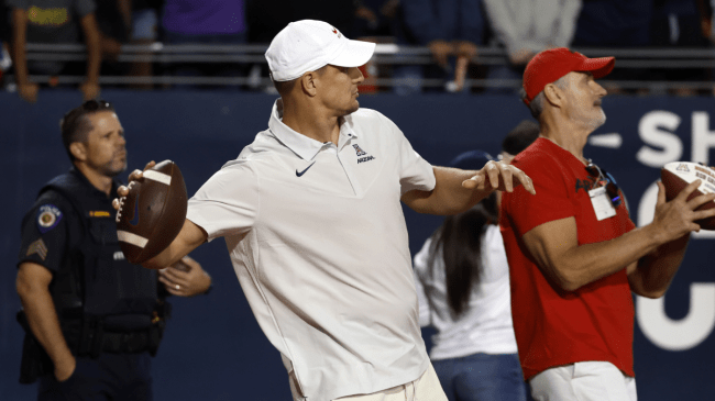 Rob Gronkowski tosses a football.