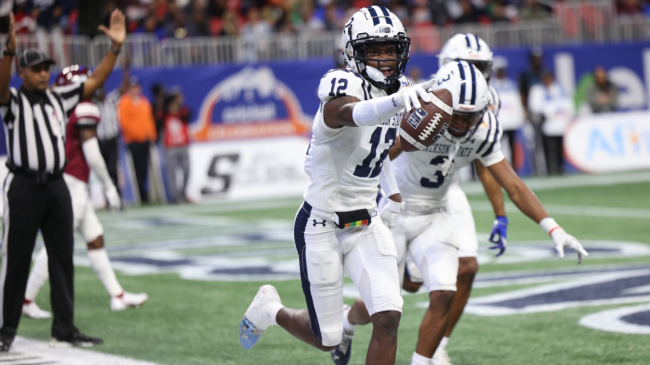 Travis Hunter celebrates a play.