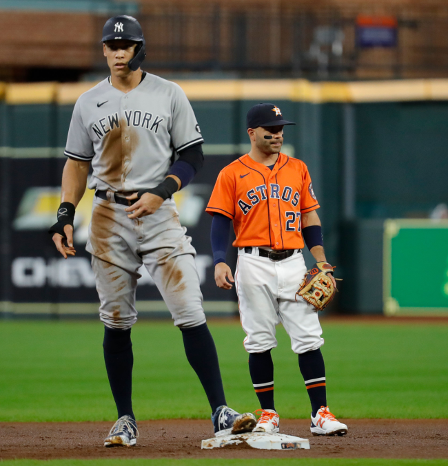 aaron judge stands next to jose altuve
