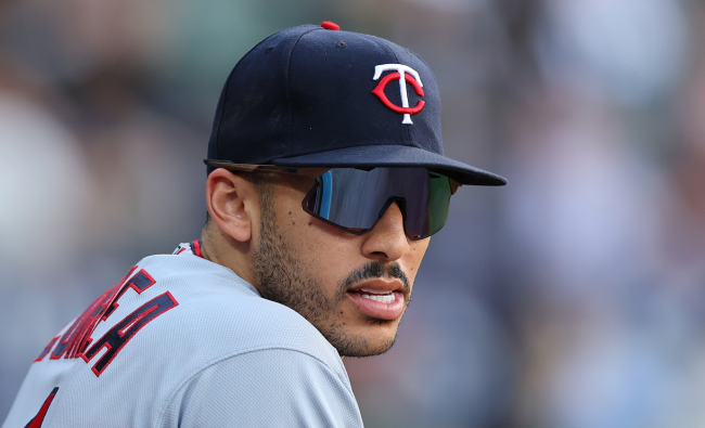 carlos correa twins hat in dugout