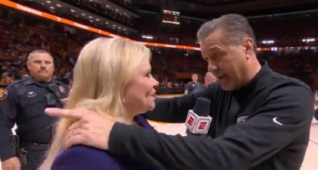 John Calipari grabbing onto Holly Rowe's shoulder