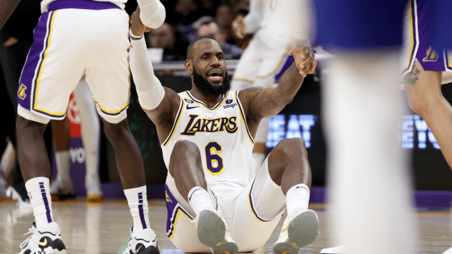 LeBron James is helped up off the floor.