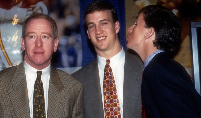 eli manning tries to kiss peyton at the draft
