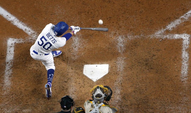 mookie betts hits ball top view selling house