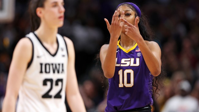 Angel Reese celebrates LSU's national championship win.