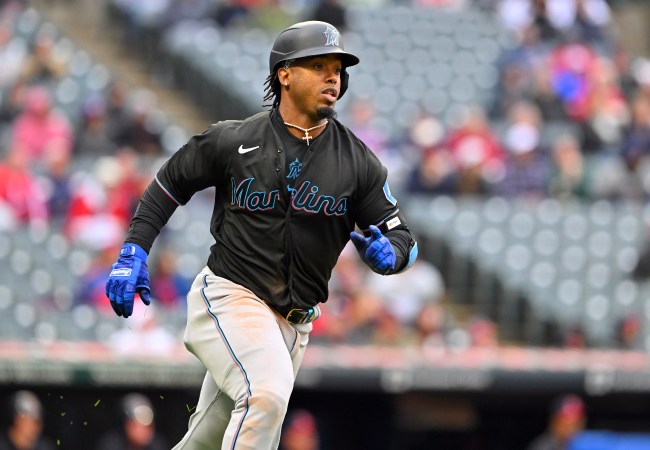 Jean Segura runs down the first base line after putting the ball in play.
