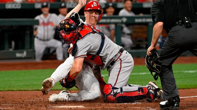 St. Louis Cardinal Tyler O'Neill is tagged out at home plate.
