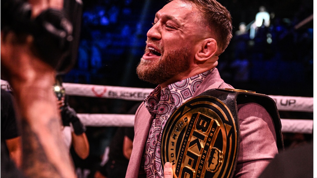 Conor McGregor holding the BKFC belt