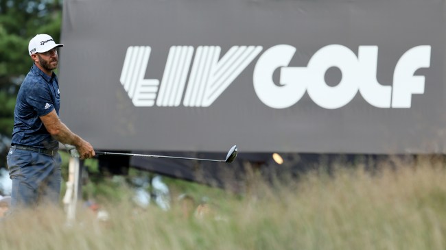 Dustin Johnson next to LIV Golf sign