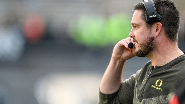 Head coach Dan Lanning on the sidelines at an Oregon Ducks football game.
