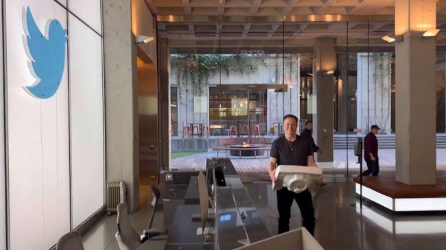 elon musk holding a sink