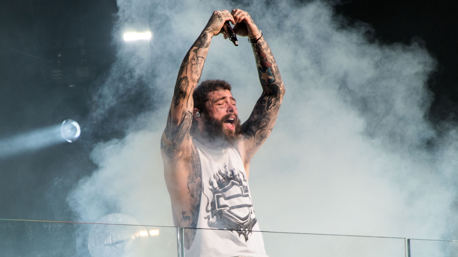 Post Malone in concert performing
