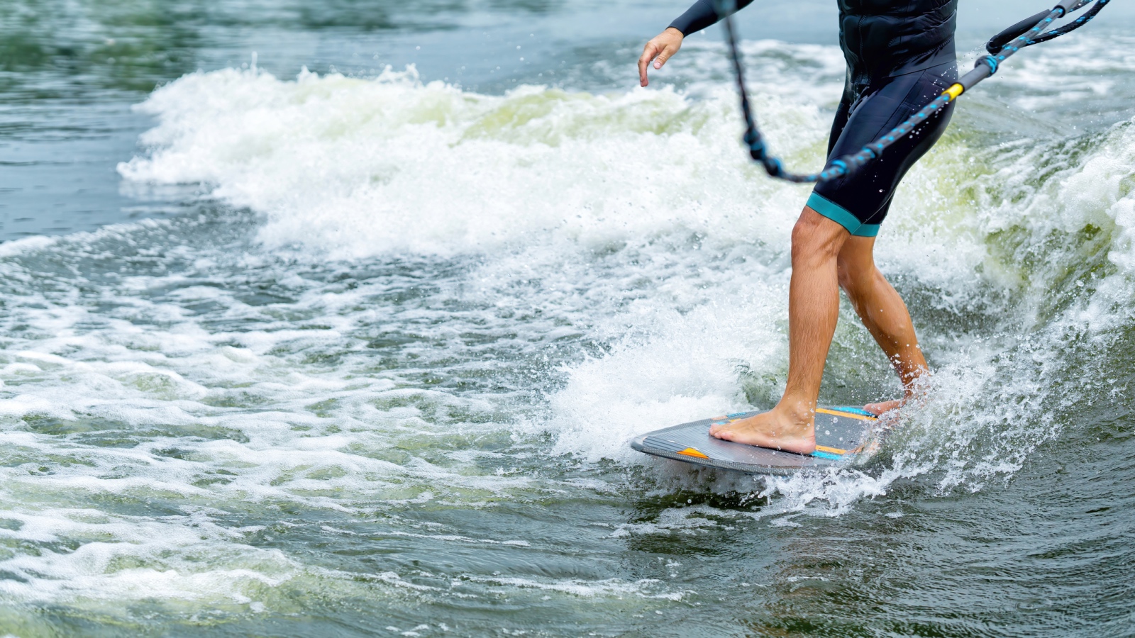 wake surfing closely behind a boat