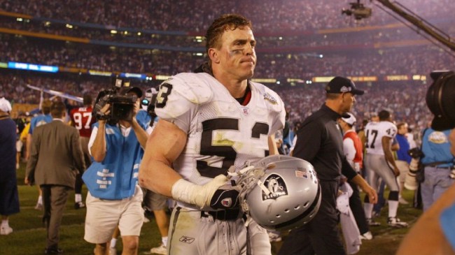 Bill Romanowski on field after a win